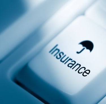 insurance - computer keyboard with a black umbrella on it