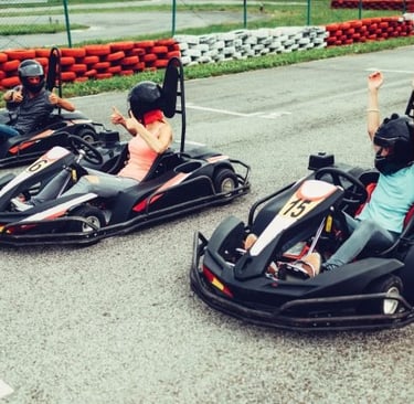a group of people riding go karts in a race