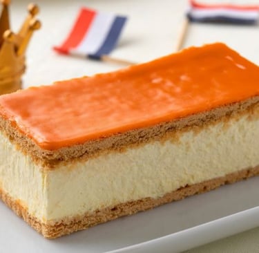 a piece of cake with orange and white icing