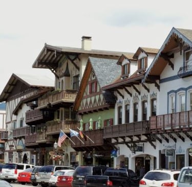 Leavenworth - a street scene with cars parked on the side of the road