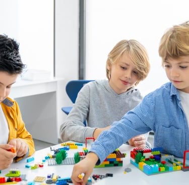 a group of children playing with legos