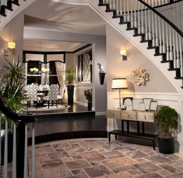 a staircase way with a couch and a table