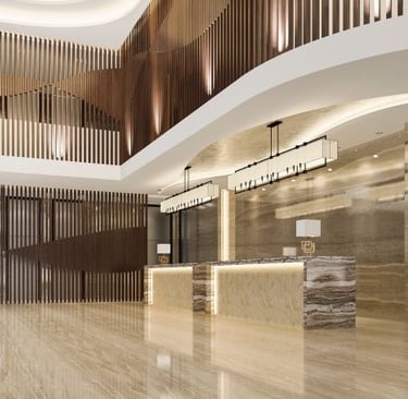 a luxury lobby area with a reception table and a reception table