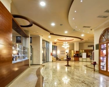 a lobby area with a large glass display case