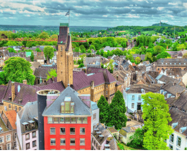 a maastricht cityscape of a church with a clock tower