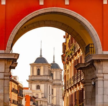 a person walking down a street with a clock tower in the background