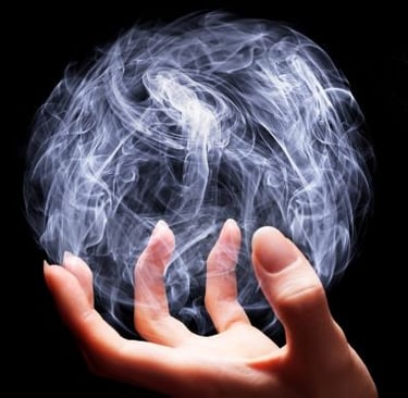 magic - a person holding a ball of smoke on a black background
