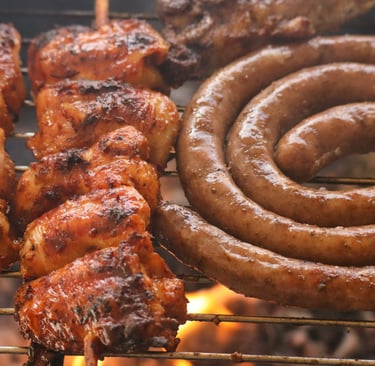 a grill with sausages and sausages on it