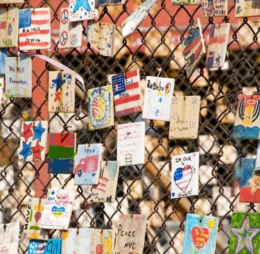 a fenced in area with many cards and pictures