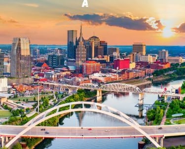 Nashville - a city skyline with a bridge and a bridge over a river