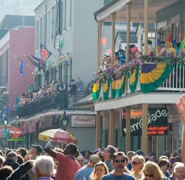 a crowd of people standing on a street  in New Orleans