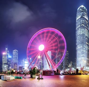 a ferris wheel in the city at night