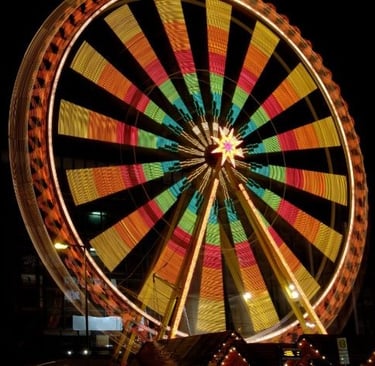 a ferris wheel with a ferris wheel in the middle of a ferris wheel