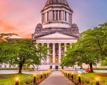 a building with a clock tower and a walkway
