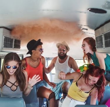 party - a group of people sitting on a bus