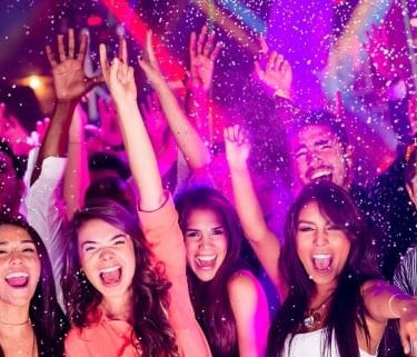 a group of people standing around a party