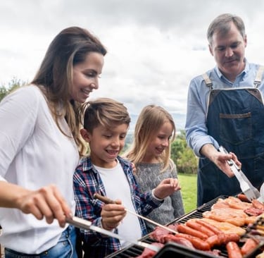 a family cooking together in a barbecue grill