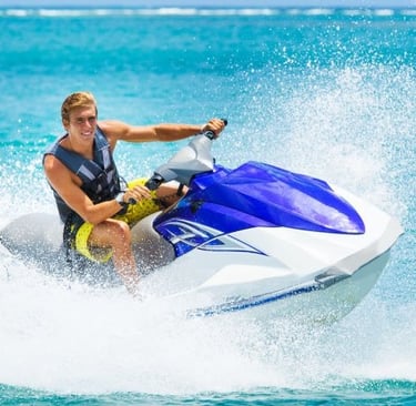 a man riding a jet ski in the ocean