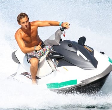 a man riding a jet ski in the water
