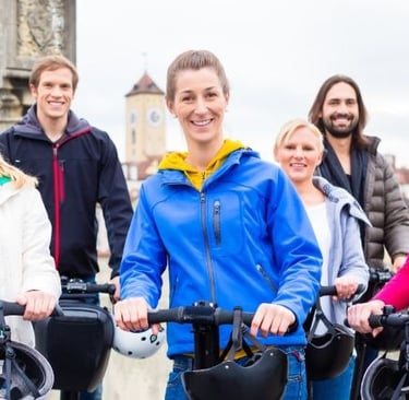 a group of people enjoying segways
