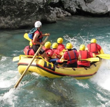 a group of people in a raft raft raft rafting down a river