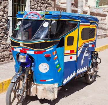 a blue and yellow rickshaw