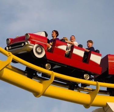 a group of people riding on a roller coaster