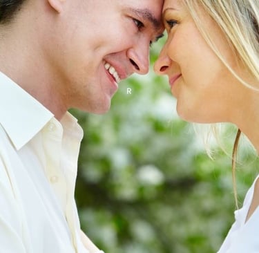 a man and woman smiling at each other