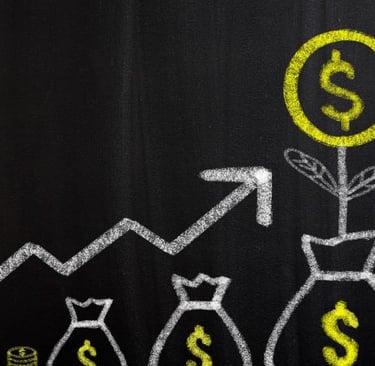 a chalkboard drawing of a graphing of a graphing line of money bags