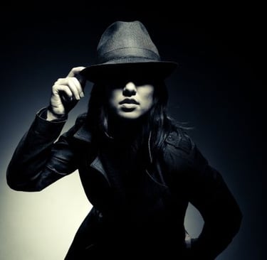 a woman with a hat is spying the environment