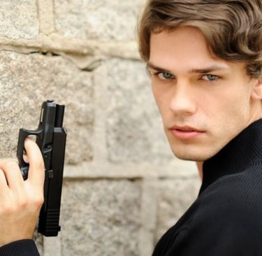a man in a black jacket holding a gun