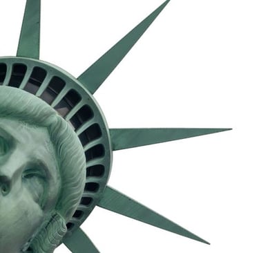 a statue of liberty in front of a white sky