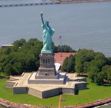 a statue of liberty in front of a body of water