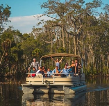 a group of people on a boat in the water
