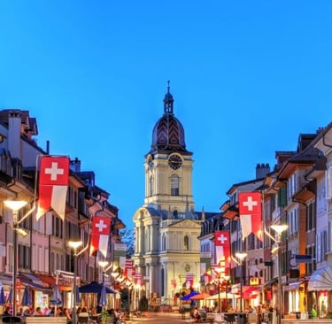a street scene with a church steeple and a clock tower