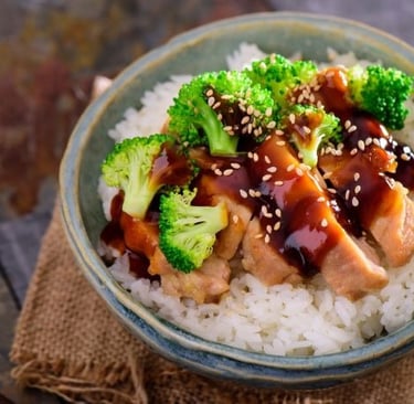a bowl of rice with broccoli and teriyaki