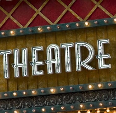 a theatre sign with a large sign that says theatre