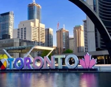 a large sign that says toronto on the front of a building