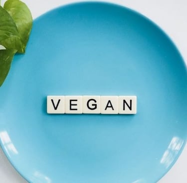 plates with sign “vegan” on it