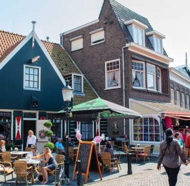 a group of people walking down a brick street