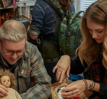 young couple making a voodoo doll