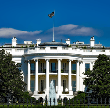 white house - a large white house with a fountain in front of it