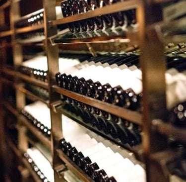 a wine rack with bottles of wine and bottles of wine