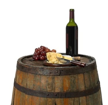 a wine barrel with cheese and wine