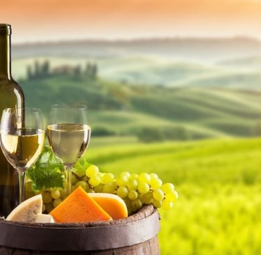 a wine barrel with wine glasses and a bottle of wine