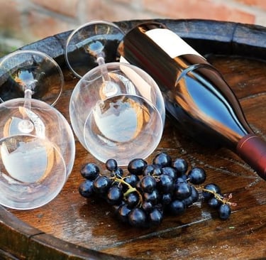 a wine glass and wine glasses on a barrel barrel