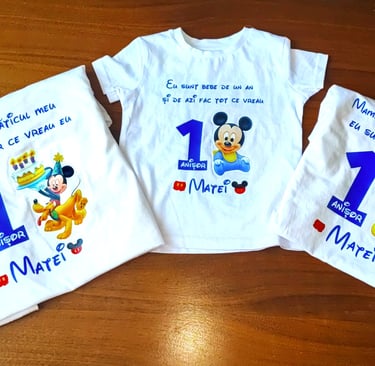 a group of three shirts with mickey mouse shirts