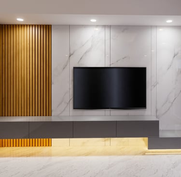 a tv screen mounted on a wall in a living room