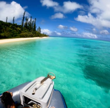 a person is sitting on a boat in the ocean