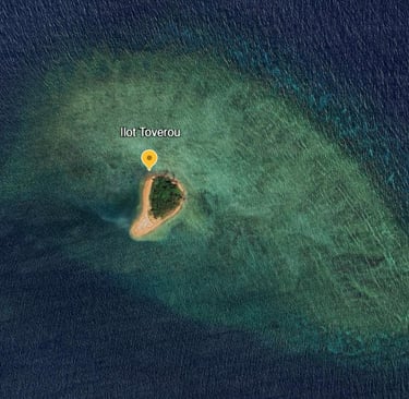 a small island with a yellow pinpoint marker marker on it
